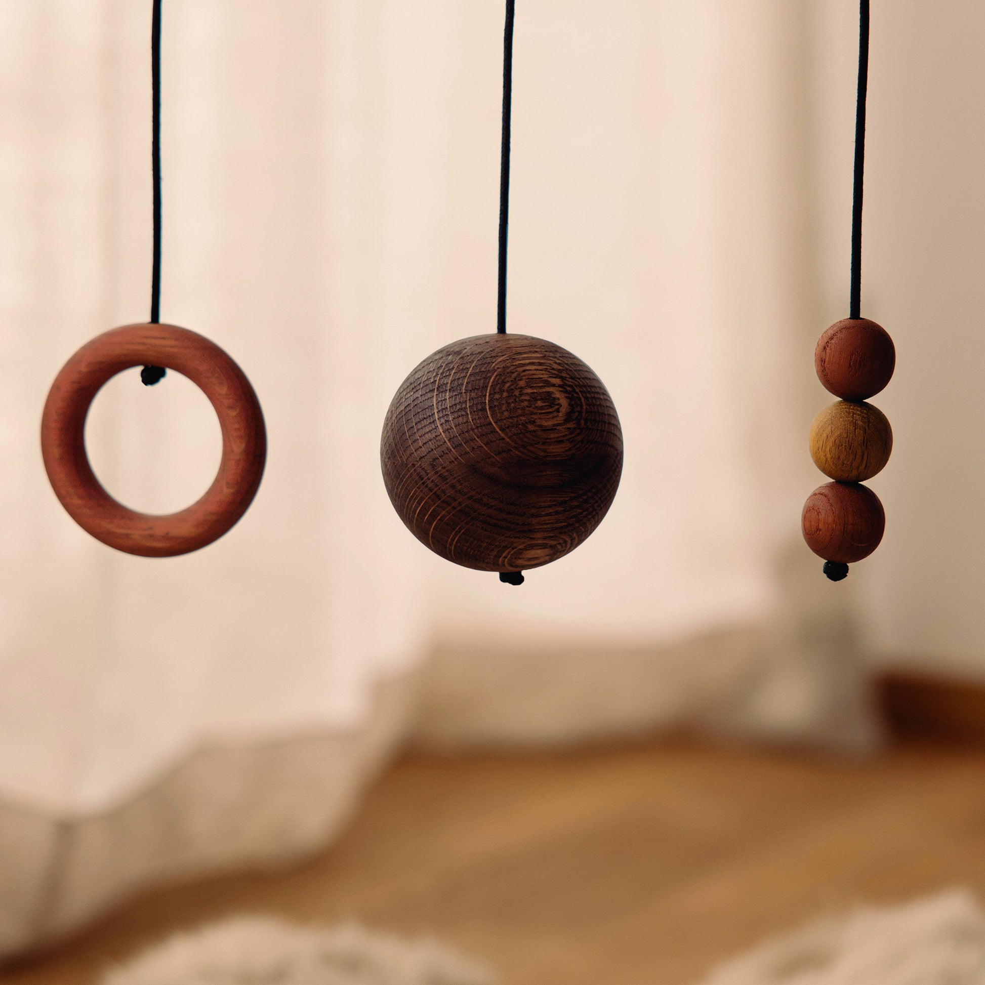 Wooden baby gym details made of FSC-certified solid oak. Play & Read in Black Oak with Earth Palette by Woodsie Wonder.