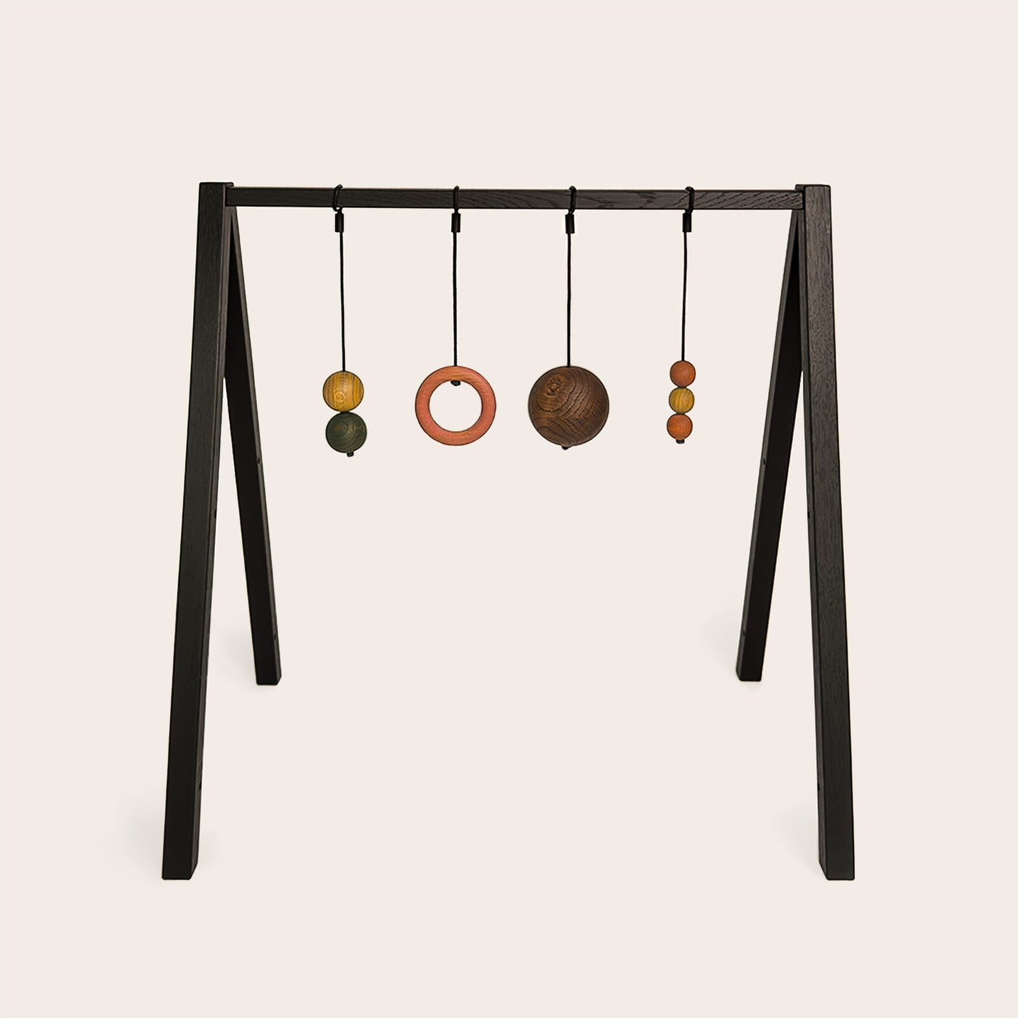 Wooden baby gym that transforms into a children's bookshelf. Play & Read in Black Oak with Earth Palette by Woodsie Wonder.