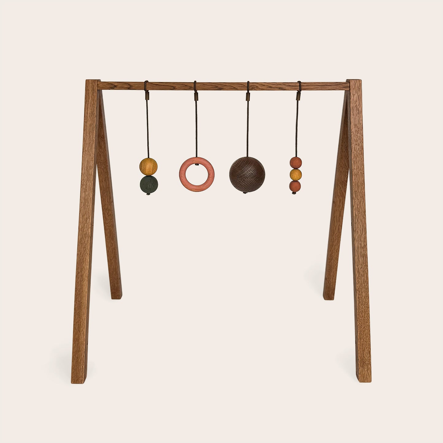 Wooden baby gym that transforms into a children's bookshelf. Play & Read in Brown Oak with Earth Palette by Woodsie Wonder.