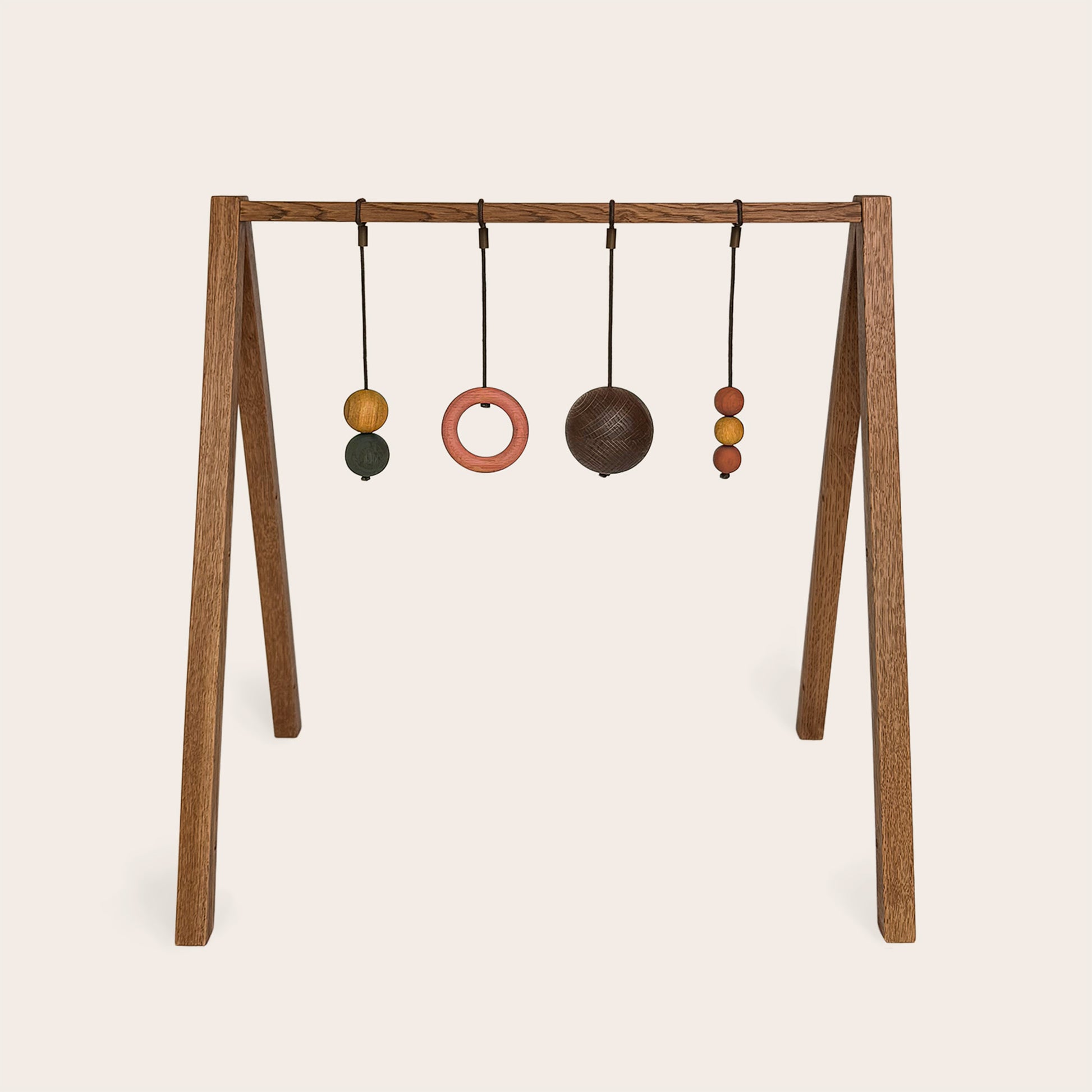 Wooden baby gym that transforms into a children's bookshelf. Play & Read in Brown Oak with Earth Palette by Woodsie Wonder.