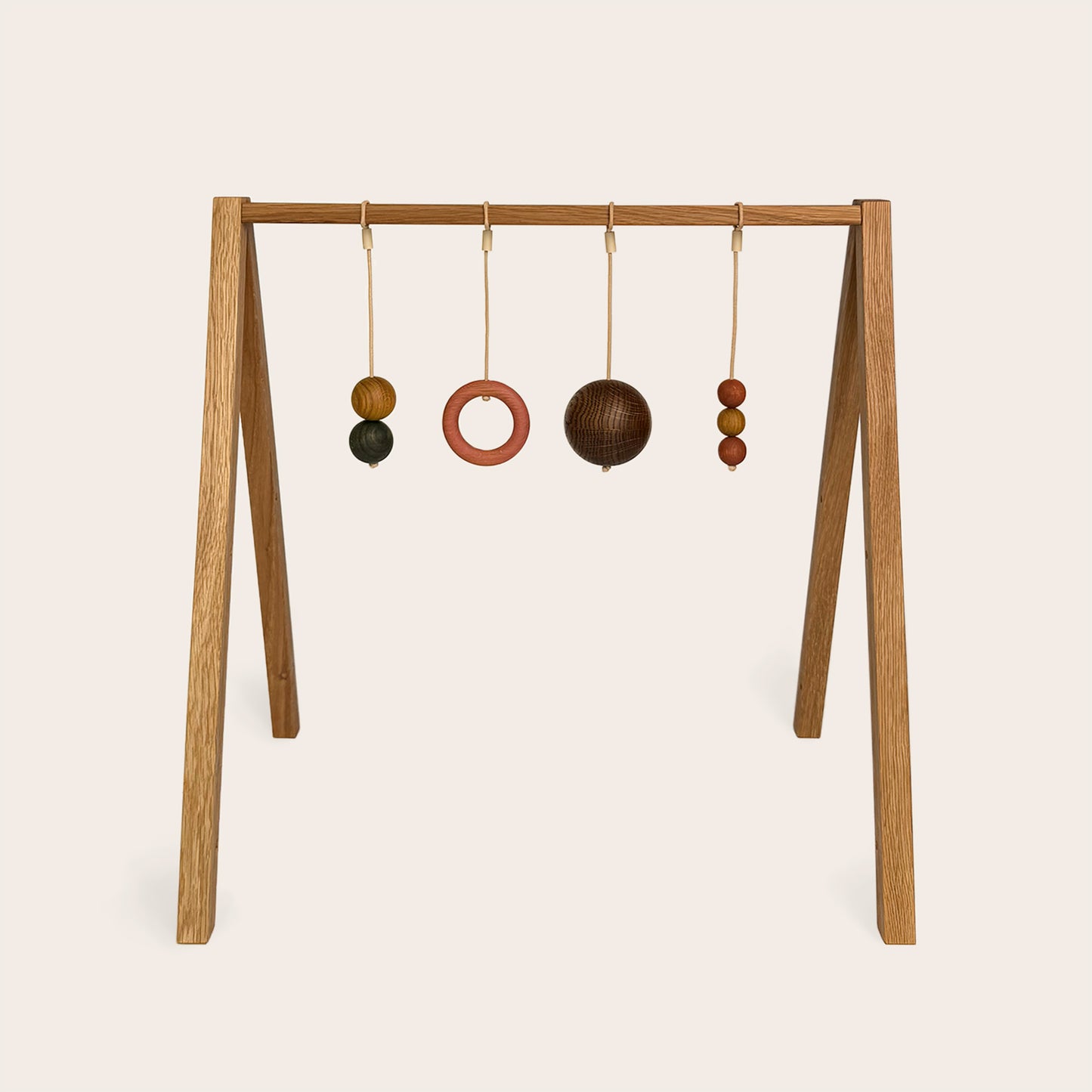 Wooden baby gym that transforms into a children's bookshelf. Play & Read in Natural Oak with Earth Palette by Woodsie Wonder.