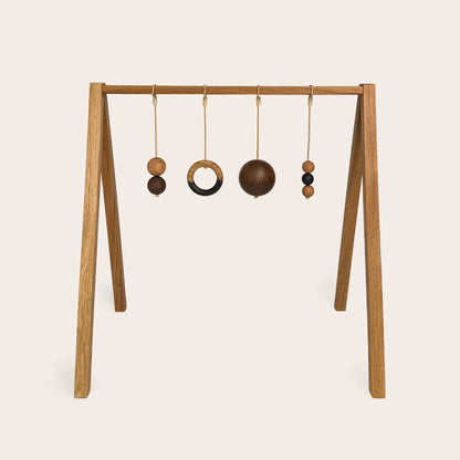 Wooden baby gym that transforms into a children's bookshelf. Play & Read in Natural Oak with Mono Palette by Woodsie Wonder.