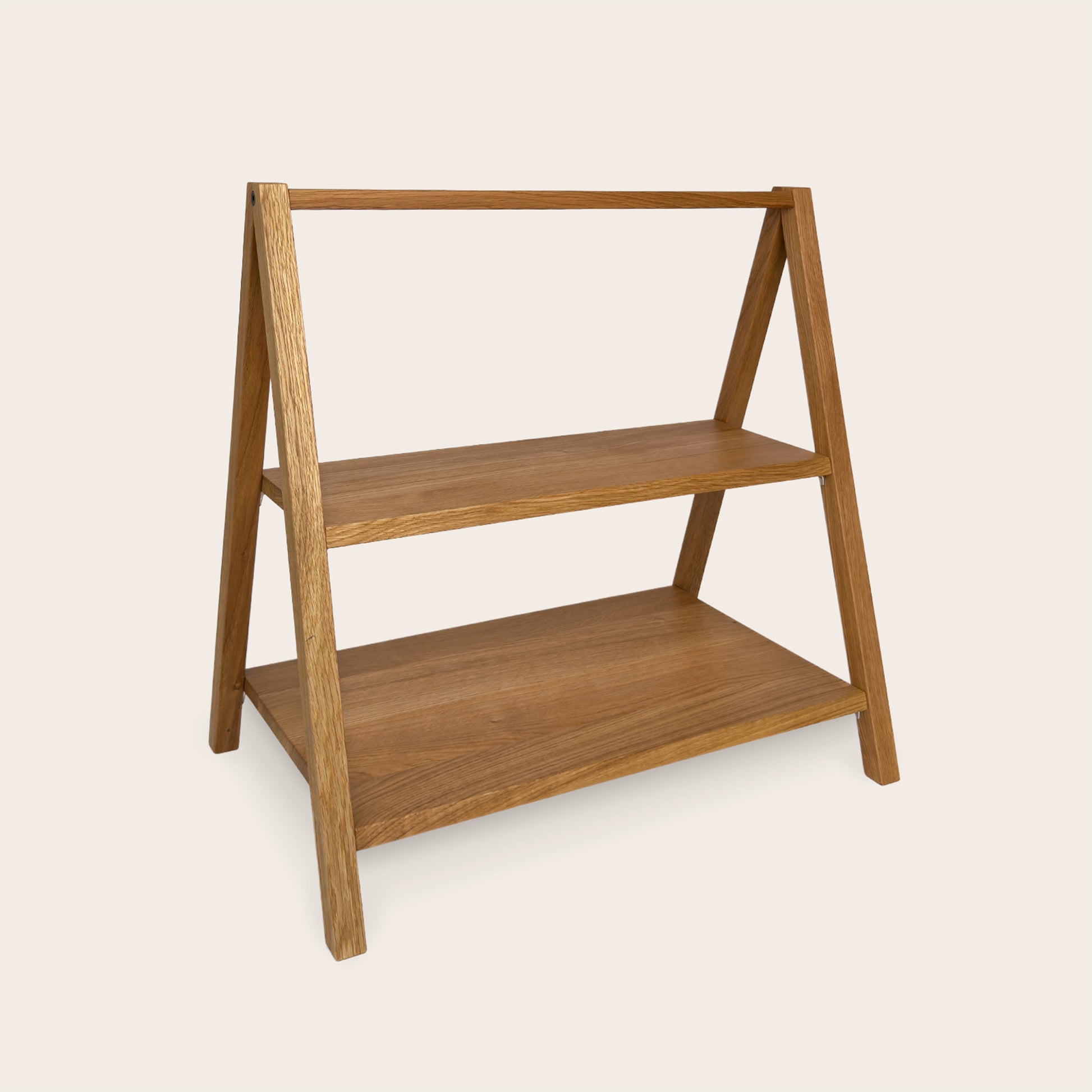 Wooden children's bookshelf and play gym in one. Play & Read in Natural Oak by Woodsie Wonder.