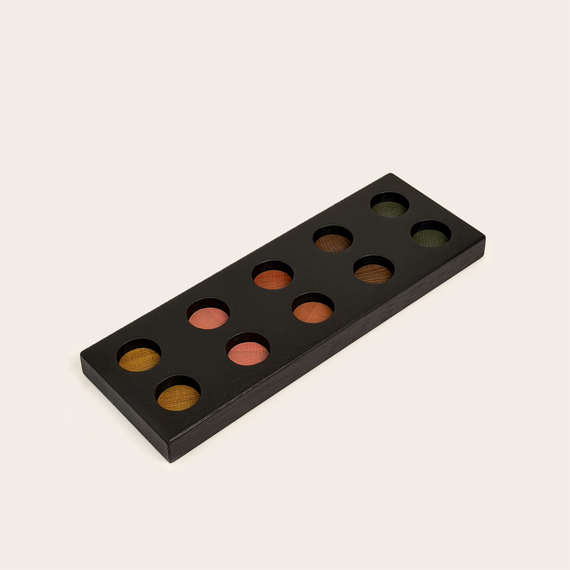 Play & Hang in Black Oak with Earth Palette, showing the wooden pegboard with holes for the matching play figures.