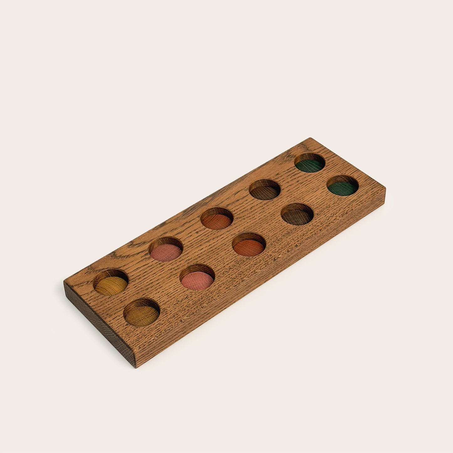 Play & Hang in Brown Oak with Earth Palette, showing the wooden pegboard with holes for the matching play figures.