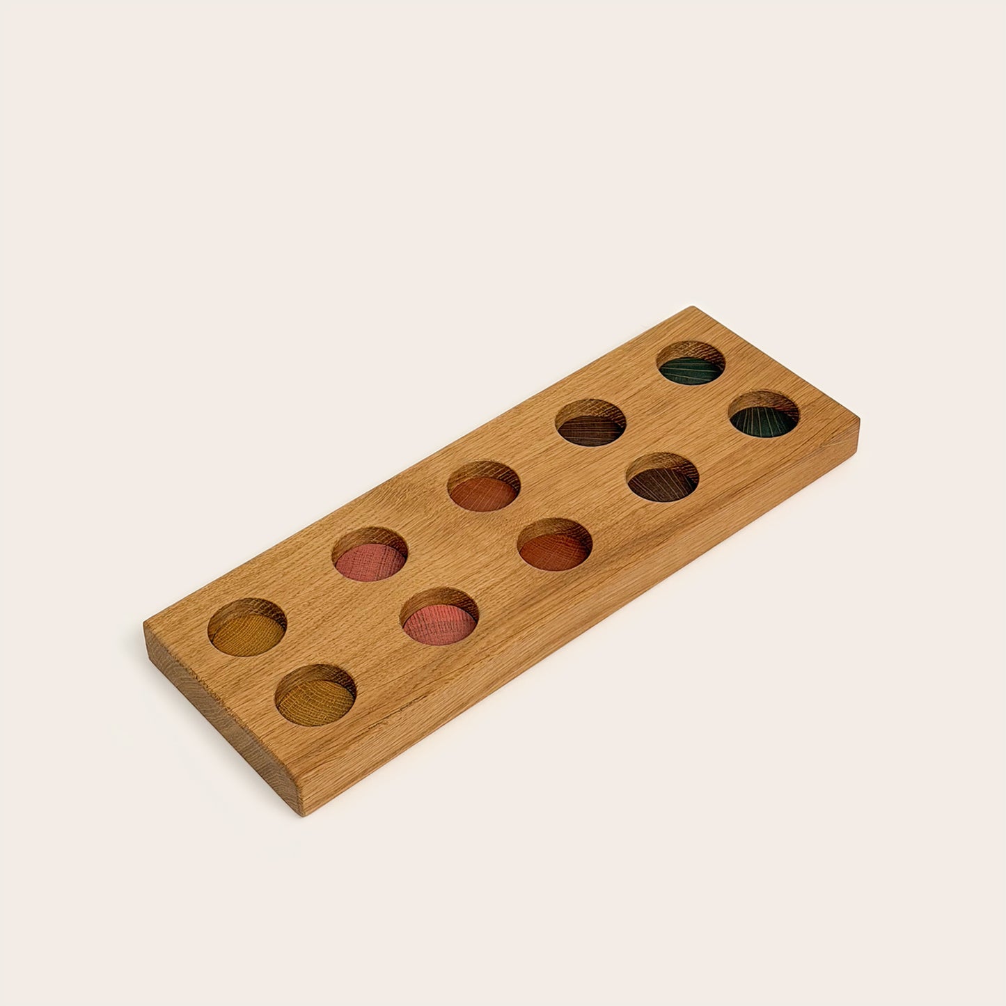 Play & Hang in Natural Oak with Earth Palette, showing the wooden pegboard with holes for the matching play figures.