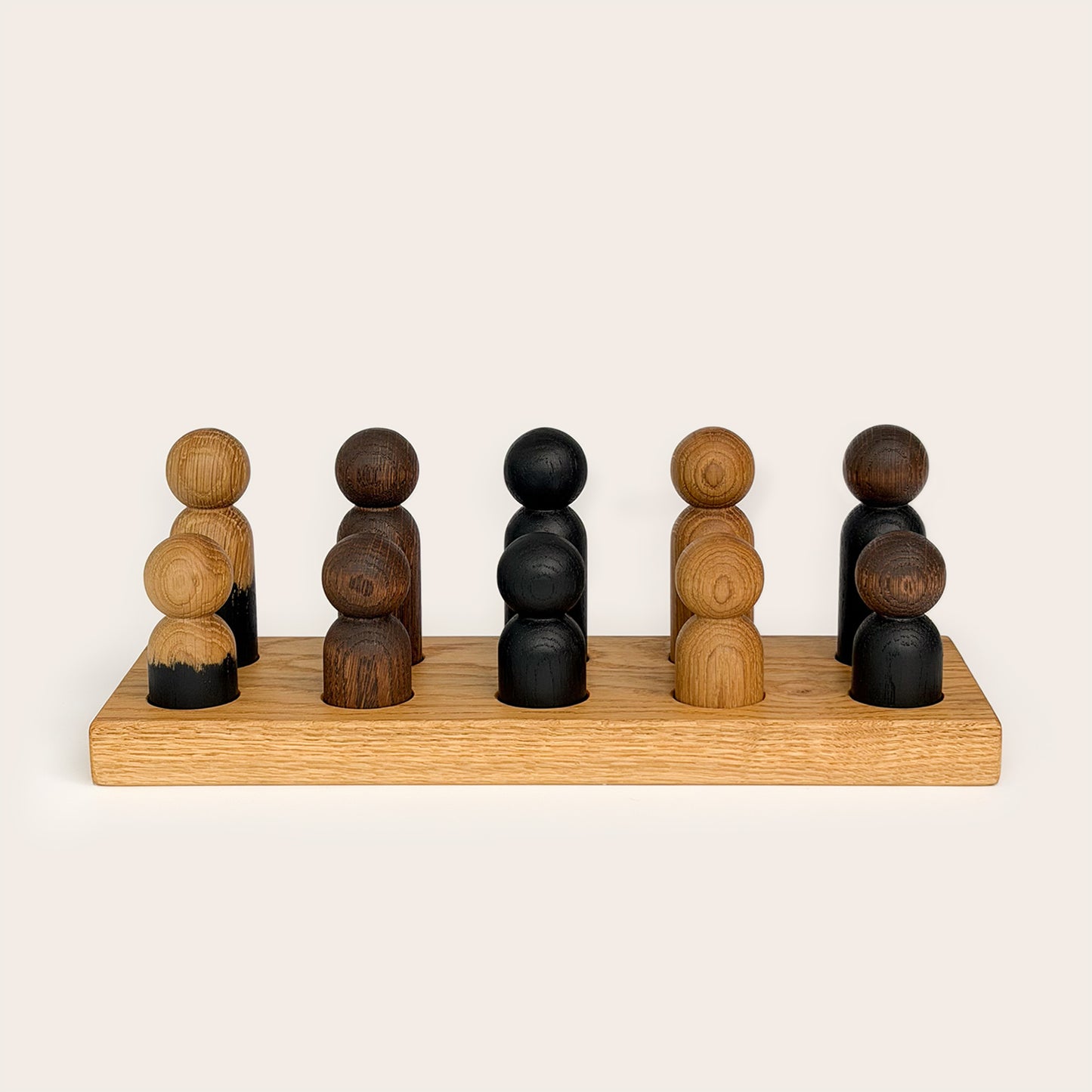 Play & Hang in Natural Oak with Mono Palette, a wooden sorting toy that transforms into a children's coat rack by Woodsie Wonder.